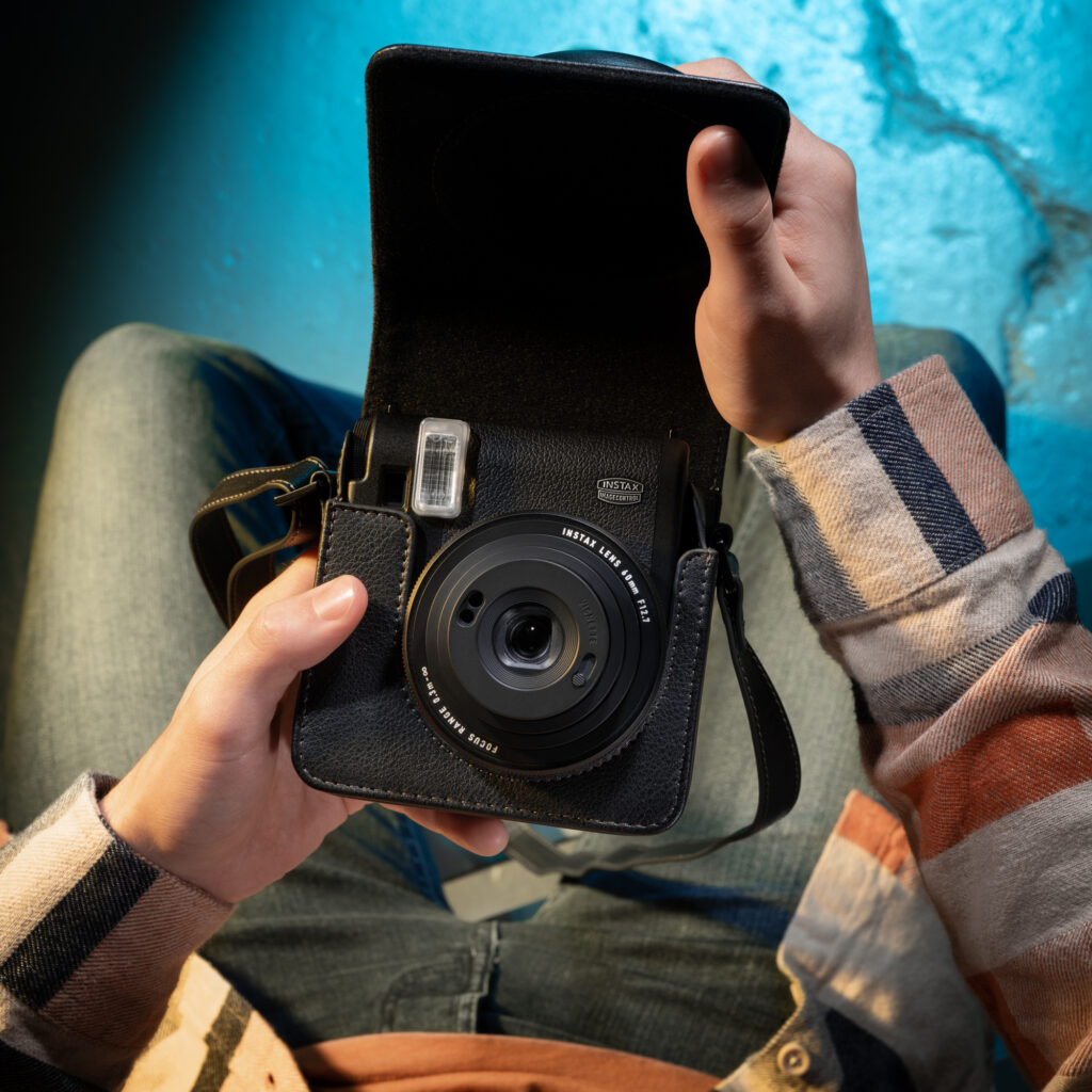 Your phone stays in your pocket. Your instax™ camera goes to the gig.
