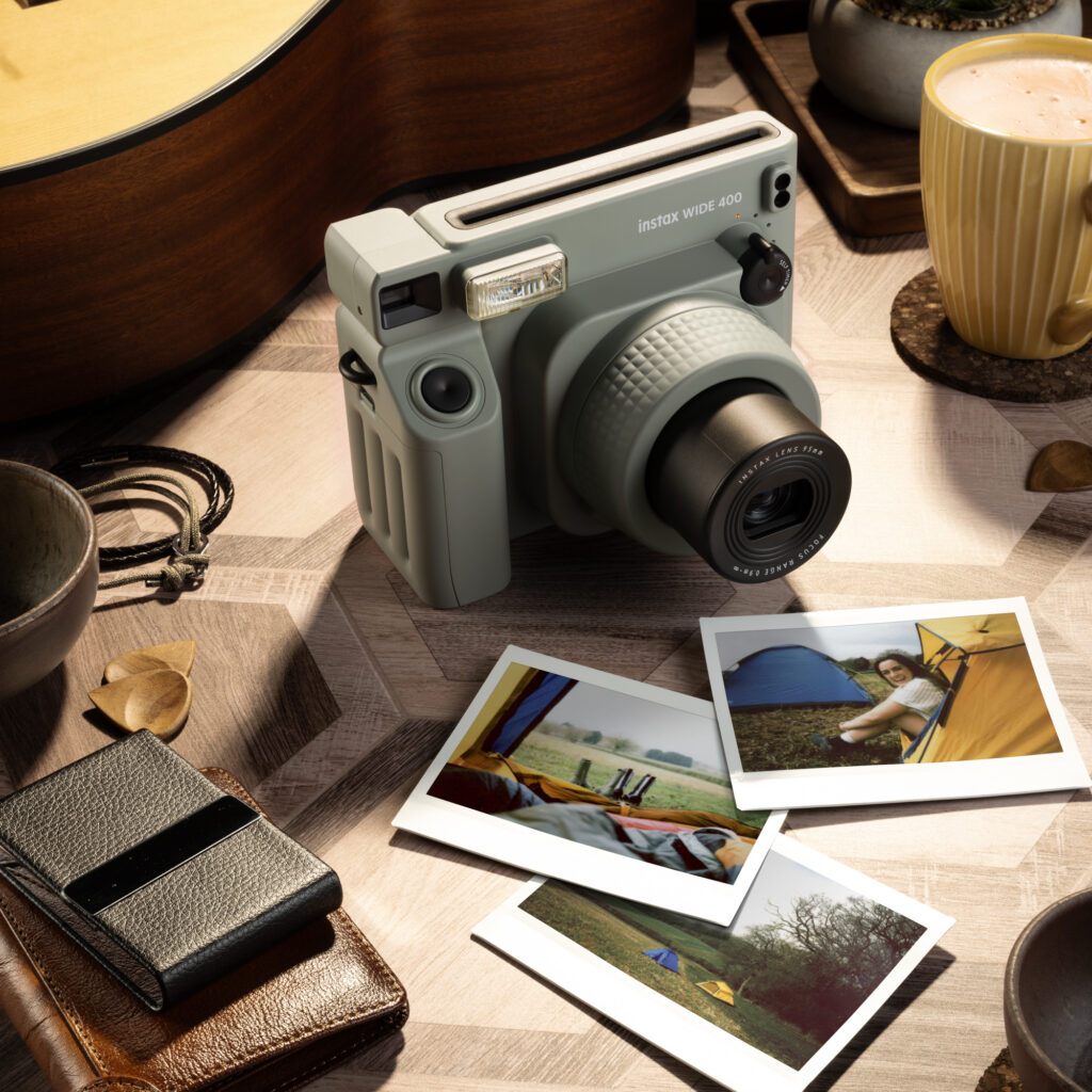 instax WIDE 400™ for the big view When you want to capture scale, the instax WIDE 400™ is the one. WIDE format film gives you roughly twice the image area of mini, so there's room for the full sweep of a golden hillside, a seafront at low tide, or a group of mates against a sunset sky. Landscape mode handles everything beyond 3 metres.